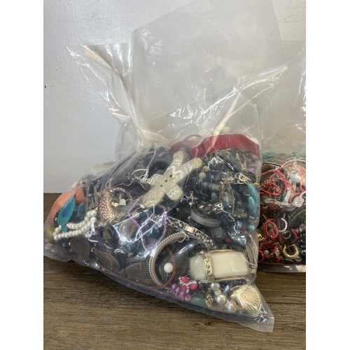 416 - Four bags containing a large quantity of costume jewellery