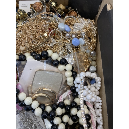 417 - A box containing a large quantity of costume jewellery