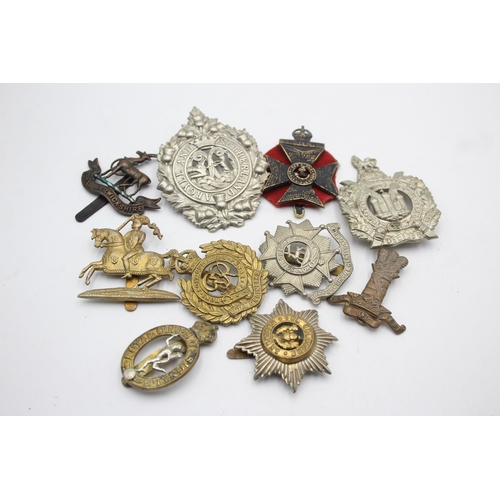 1393 - Ten military cap badges to include KOSB, Bedforshire & Hertfordshire, Hussars etc.