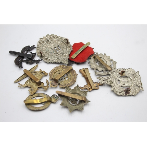 1393 - Ten military cap badges to include KOSB, Bedforshire & Hertfordshire, Hussars etc.