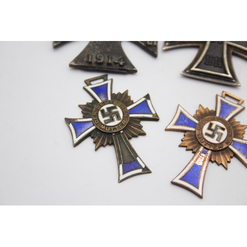 1395 - Five German medals to include WWI Iron Cross, Honorary Medal of the Legion etc.