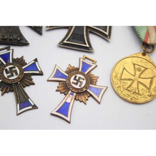 1395 - Five German medals to include WWI Iron Cross, Honorary Medal of the Legion etc.