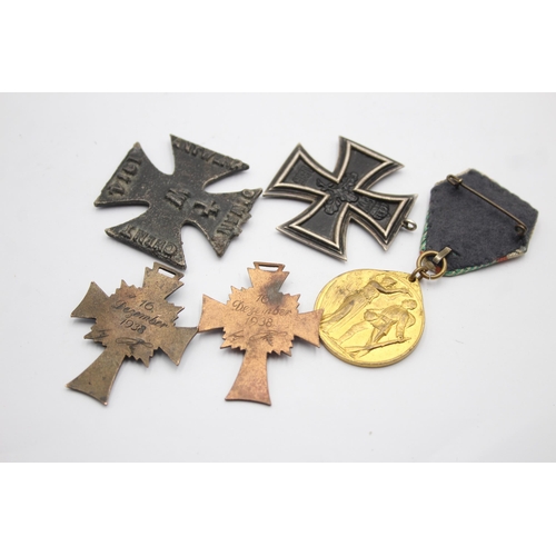 1395 - Five German medals to include WWI Iron Cross, Honorary Medal of the Legion etc.