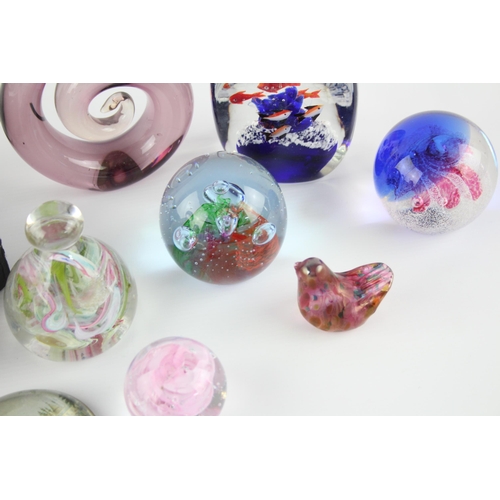 326E - A collection of paperweights to include Isle of Wight Glass, Royal Pavillion etc.