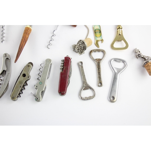 344 - Approx. twenty corkscrews and bottle openers to include brass, wood etc.