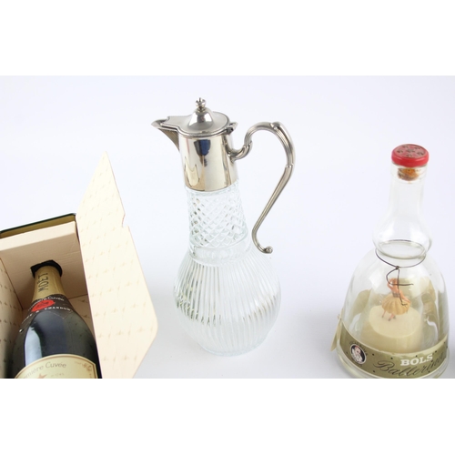 348 - Eight breweriana items to include Moet Chandon tin and bottle, Wade decanter etc.