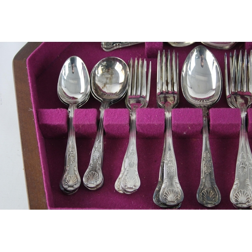 357 - A vintage silver plate forty four piece cutlery set with wooden canteen