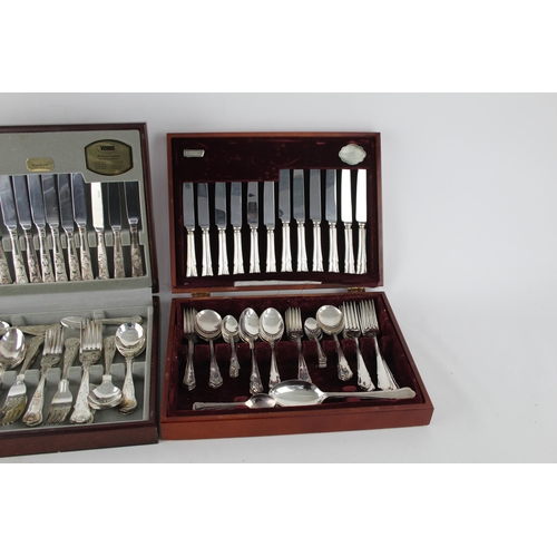 359 - Two vintage silver plate cutlery sets with wooden canteens