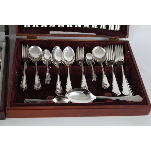 359 - Two vintage silver plate cutlery sets with wooden canteens