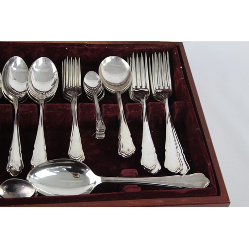 359 - Two vintage silver plate cutlery sets with wooden canteens