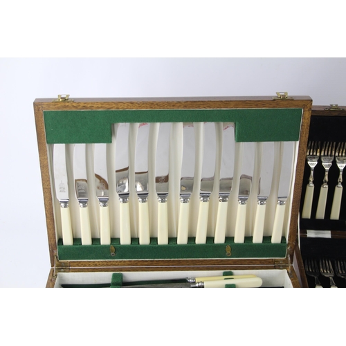 360 - Three vintage wooden cased silver plated cutlery sets