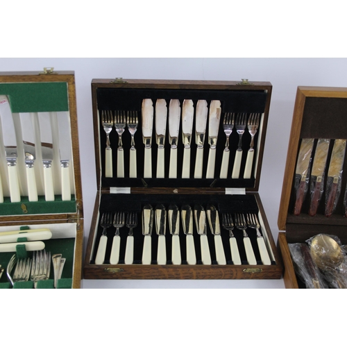 360 - Three vintage wooden cased silver plated cutlery sets