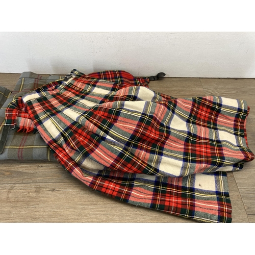 403 - Three tartan kilts to include Moffat pure new wool, Craigmere etc. - sizes: 20, W28 W40