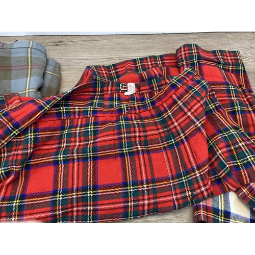 403 - Three tartan kilts to include Moffat pure new wool, Craigmere etc. - sizes: 20, W28 W40