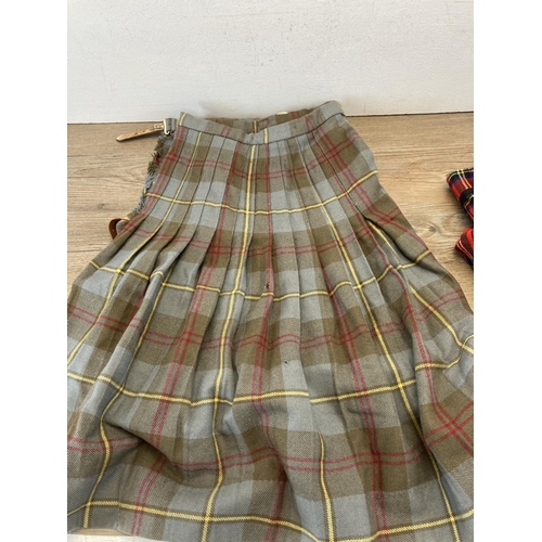 403 - Three tartan kilts to include Moffat pure new wool, Craigmere etc. - sizes: 20, W28 W40