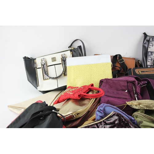 406 - A large collection of handbags to include faux leather, iridescent, clutch etc.