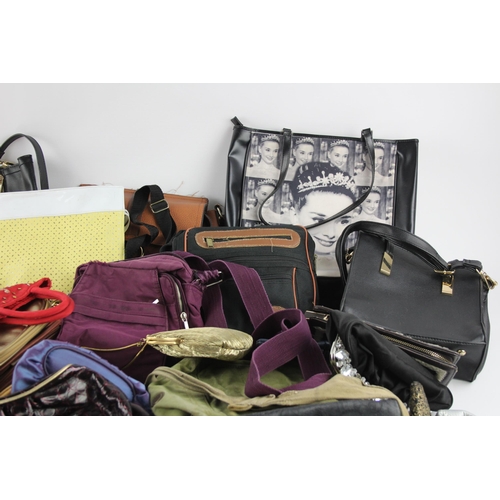 406 - A large collection of handbags to include faux leather, iridescent, clutch etc.