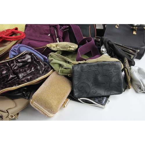 406 - A large collection of handbags to include faux leather, iridescent, clutch etc.