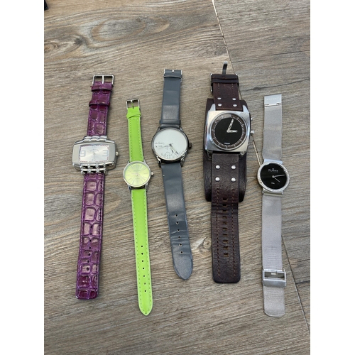 410 - A collection of men's and women's wristwatches to include Swatch, Rotary, Pulsar etc.