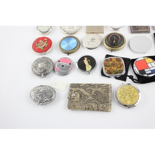 425 - A large collection of compact mirrors to include Celtic, Mackintosh, St Justin etc.