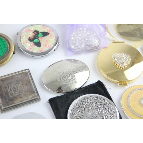 425 - A large collection of compact mirrors to include Celtic, Mackintosh, St Justin etc.