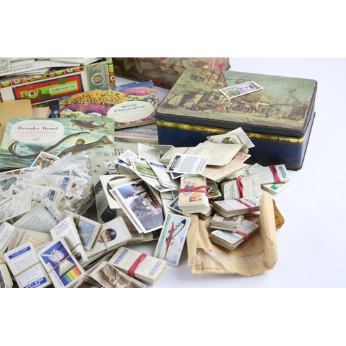 465 - A collection of antique and vintage cigarette cards to include sports, military etc.