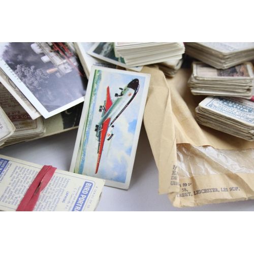 465 - A collection of antique and vintage cigarette cards to include sports, military etc.