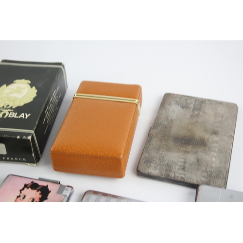 513 - A collection of cigarette cases to include combination, boxed etc.