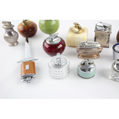 514 - A collection of table lighters to include Ronson etc.