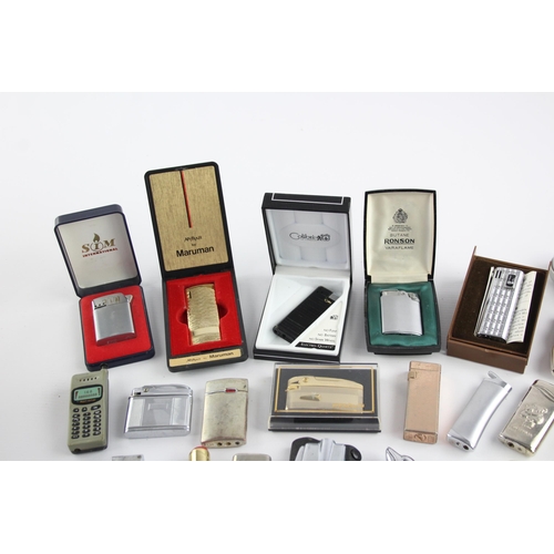 515 - A large collection of cigarette lighters to include Ronson, Colibri, Penguin etc.