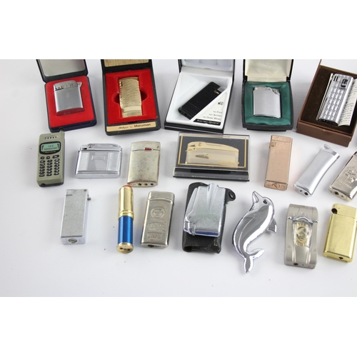 515 - A large collection of cigarette lighters to include Ronson, Colibri, Penguin etc.