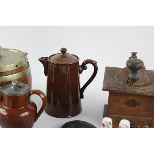 544 - A collection of kitchenalia to include biscuit barrel, cheese board, toast rack etc.