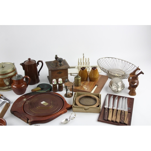 544 - A collection of kitchenalia to include biscuit barrel, cheese board, toast rack etc.