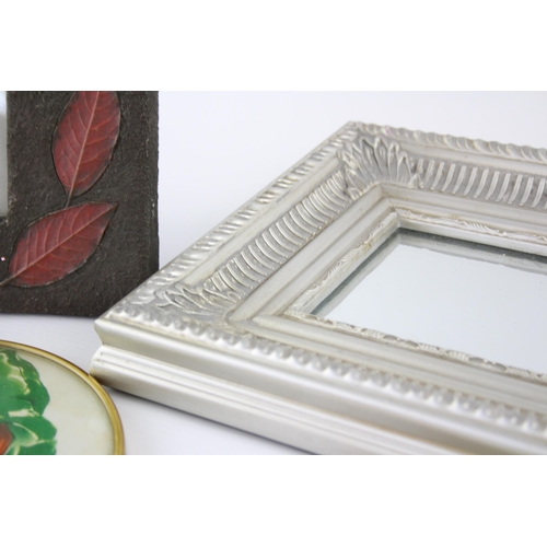 545 - A collection of wall art and frames to include framed mirrors, prints etc.