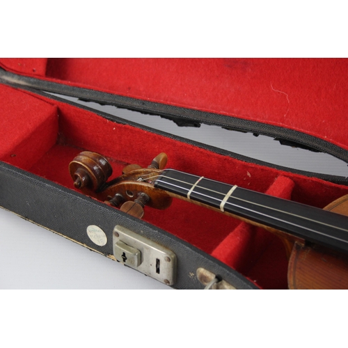 670 - An early 20th century ½ size violin with fitted case