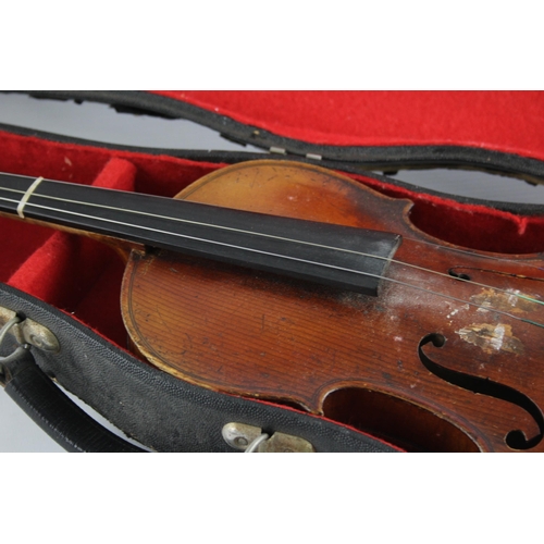 670 - An early 20th century ½ size violin with fitted case