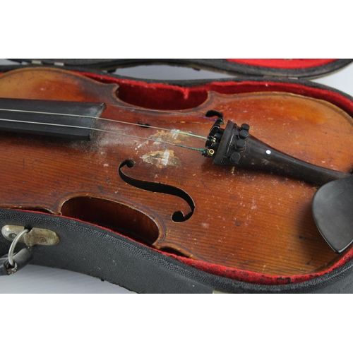 670 - An early 20th century ½ size violin with fitted case