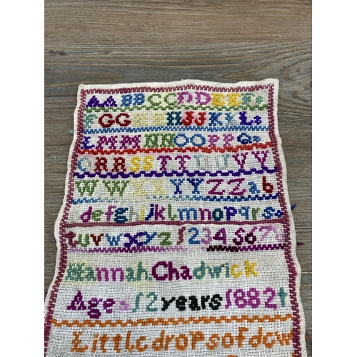 458 - A 19th century unframed sampler by Hannah Chadwick, dated 1882 - approx. 30cm high x 17cm wide