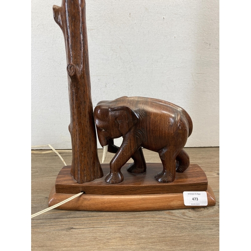 473 - A carved hardwood elephant table lamp - approx. 43cm high