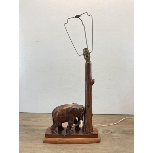 473 - A carved hardwood elephant table lamp - approx. 43cm high