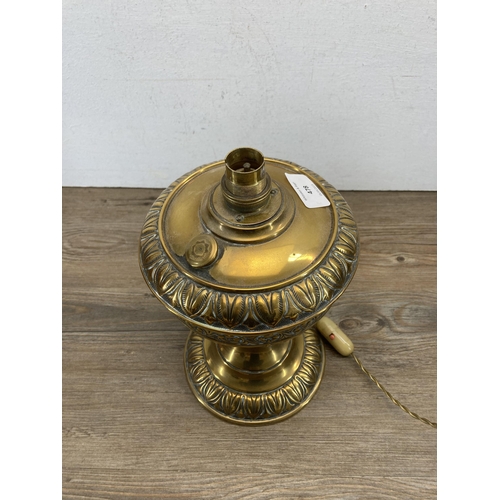 478 - A late 19th century brass electric converted oil lamp - approx. 28cm high