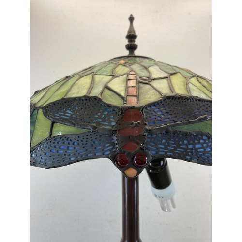 484 - A Tiffany style table lamp with dragonfly design - approx. 78cm high