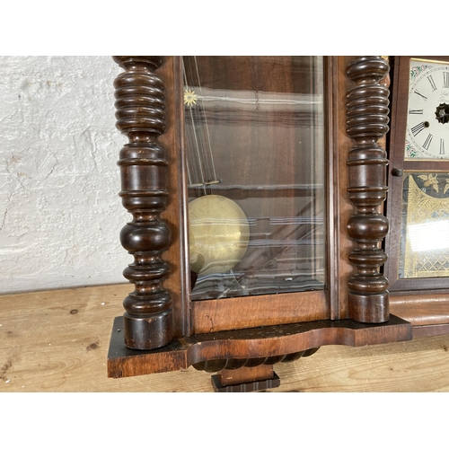 497 - Two wall clocks, one Victorian walnut cased Vienna with pendulum and key - approx. 104cm high and on... 