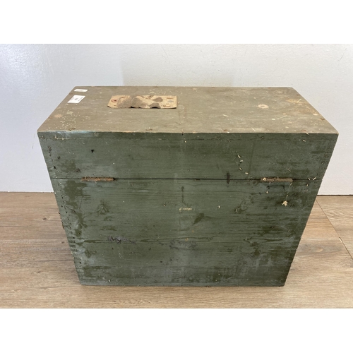 504 - A 1955 W. L. & S. Ltd. green painted military box with contents - approx. 38cm high x 45cm wide x 21... 