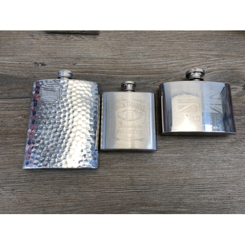 516 - A collection of hipflasks to include Glenfiddich, Jack Daniels etc.