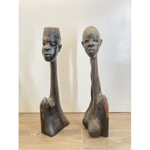 519 - Four items, two African carved hardwood busts - approx. 51cm high, one modern abstract resin bust an... 