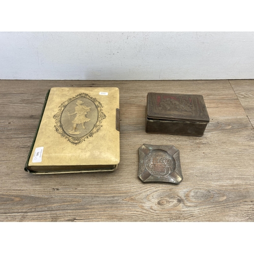 525 - Three vintage items, one tin containing corks, one oriental copper ashtray and one Victorian carte d... 