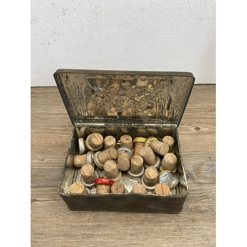 525 - Three vintage items, one tin containing corks, one oriental copper ashtray and one Victorian carte d... 