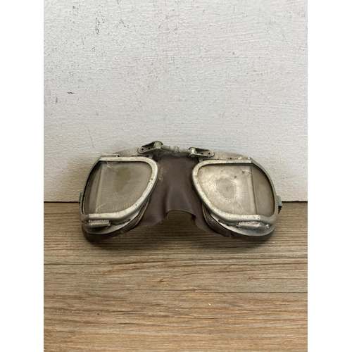 535 - A mid 20th century J. Compton Sons & Webb Ltd. The Corker motorcycle helmet with goggles