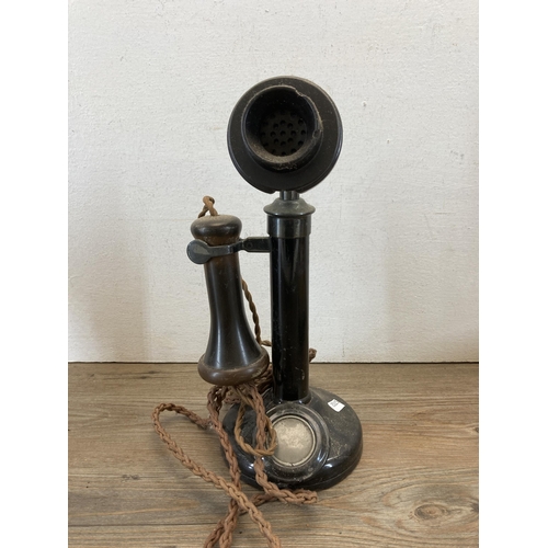 537 - Three items, one early 20th century candlestick telephone - approx. 32cm high, one Anglo Indian carv... 